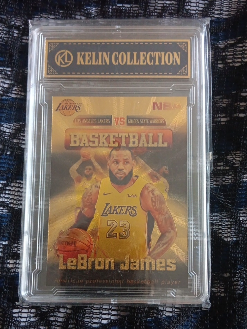 This image shows a slabbed trading card featuring LeBron James in a yellow Los A